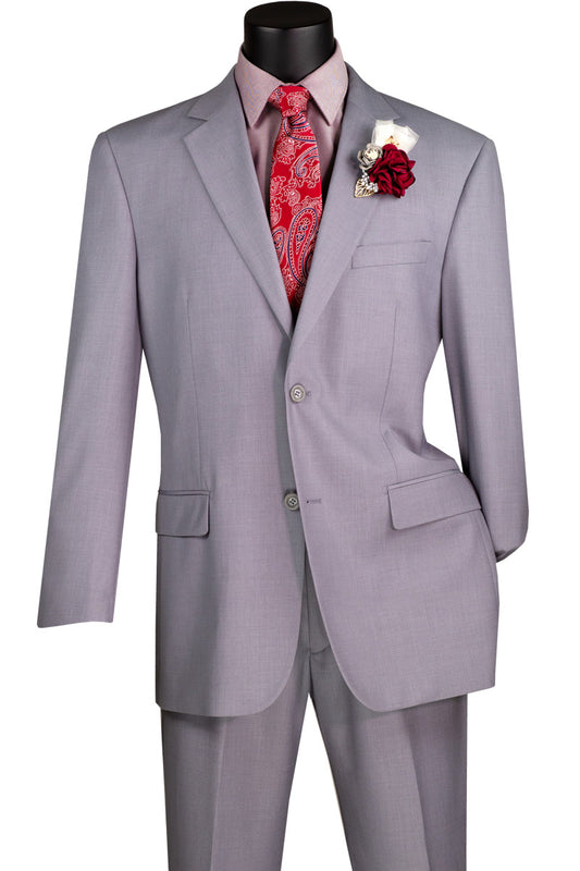 The Vinci Executive 2 Piece Suit in Light Gray by Vinci Suits showcases a single-breasted jacket with a classic notch lapel, complemented by matching pants. When styled with a red patterned tie, white shirt, and coordinating white and red boutonniere, the ensemble is perfectly completed. The suit features a 2″ adjustable waistband to ensure optimal comfort.