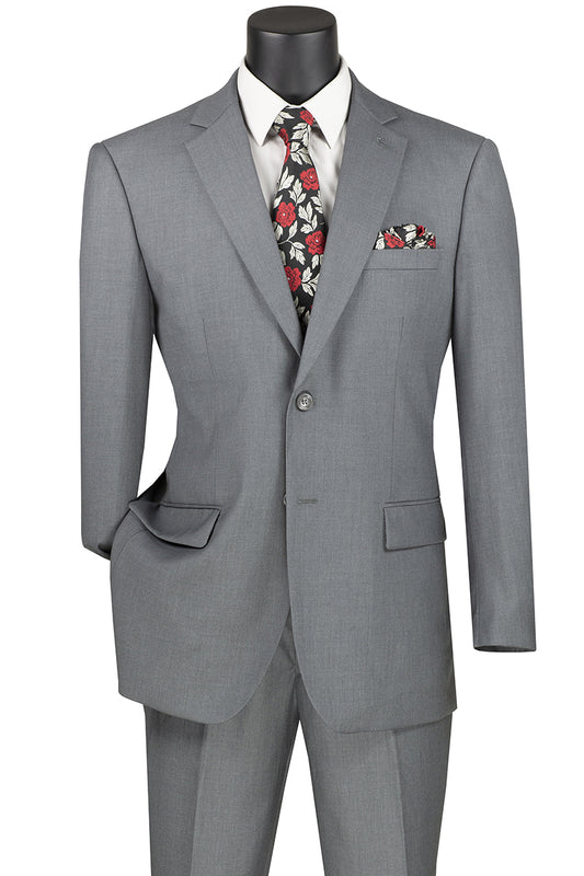 Displayed on a mannequin is the Vinci Executive 2 Piece Suit with 2″ Adjustable Waist Band in Medium Gray, featuring a single-breasted jacket with a notch lapel. It is expertly paired with a white shirt, floral tie, and matching pocket square.