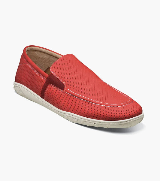 The Stacy Adams ILAN Perf Moc Toe Slip On in red (style number 25512-600) combines a sleek leather design with white stitching and a beige sole. It features a perforated pattern and cushioned footbed to ensure ultimate comfort, along with anti-microbial technology to keep your feet fresh throughout the day.