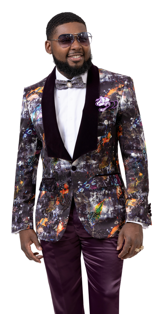 A person in sunglasses is dressed in an EJ Samuel Purple Blazer J121, enhanced with a colorful, abstract-patterned suit that includes a bow tie and a decorative lapel pin. The ensemble features a multi-color design fabric with a striking shawl lapel, enhancing its vibrant flair.