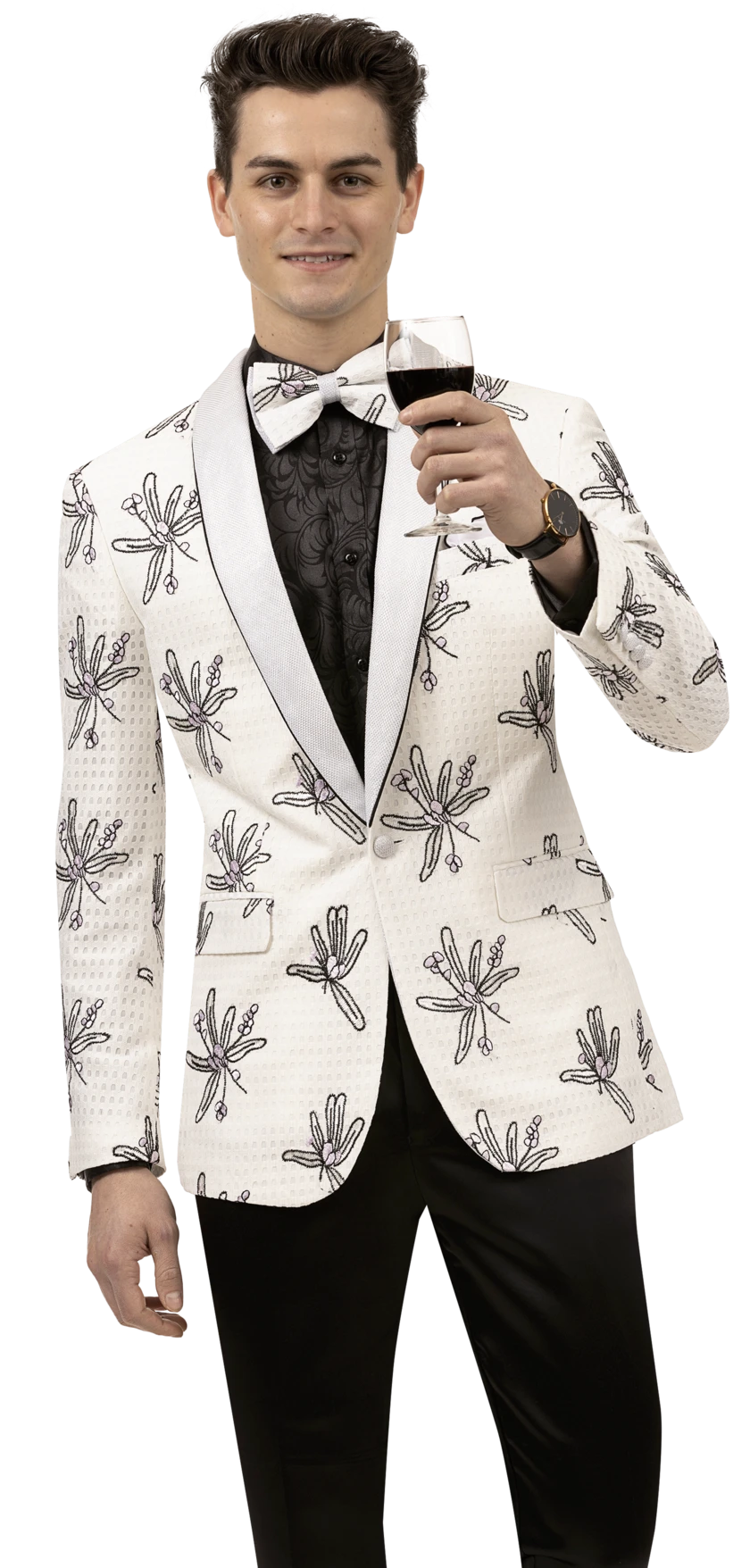 Dressed in the EJ Samuel White Blazer J127, featuring delicate black floral patterns, a person in a patterned tuxedo and black shirt gracefully holds a wine glass, smiling softly. The blazer flawlessly complements their elegant presence.