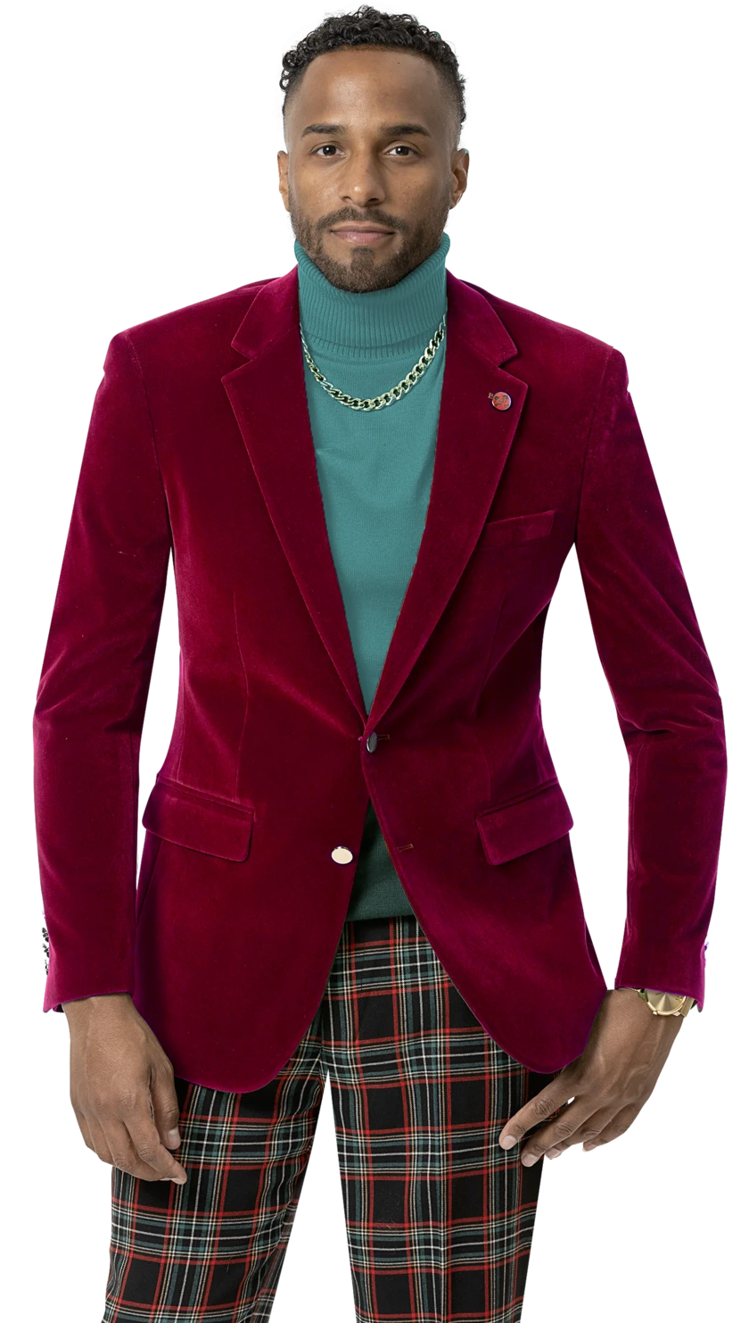 An individual is wearing the EJ Samuel Red Velvet Blazer J134 from EJ SAMUEL, featuring gold buttons, paired with a teal turtleneck, a chain necklace, and plaid pants.