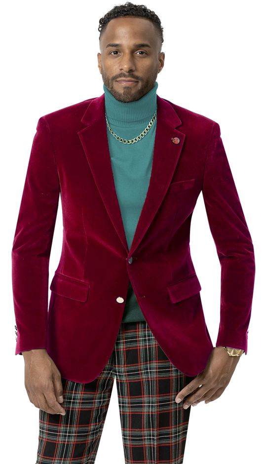 An individual is wearing the EJ Samuel Red Velvet Blazer J134 from EJ SAMUEL, featuring gold buttons, paired with a teal turtleneck, a chain necklace, and plaid pants.