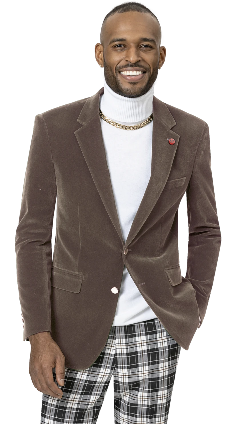 A man wearing the EJ Samuel Taupe Velvet Blazer J134, featuring gold buttons, paired with a white turtleneck and plaid pants, smiles warmly at the camera.