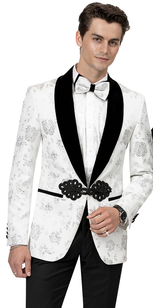 A man wearing the EJ Samuel White Blazer J168 by EJ SAMUEL, featuring a floral pattern and a fashion-forward black lapel with a matching white bow tie, sports an elegant blazer complete with a decorative belt.