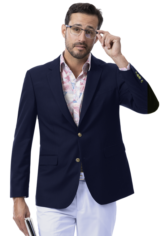 Man wearing an EJ Samuel Navy Blazer J170 with gold buttons, paired with a floral shirt, adjusts his glasses while holding a book.