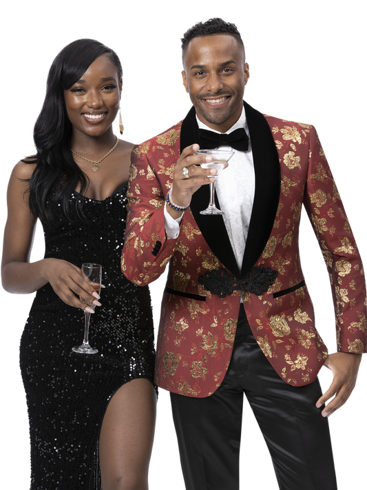 A woman in a black dress and a man wearing the EJ Samuel Blk/Red Blazer J176 with a bow tie hold glasses, smiling at the camera.