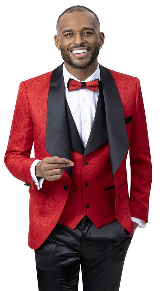 A man smiles warmly in an EJ Samuel Red Blazer J64 with satin lapels and a bow tie, holding a pair of glasses. The modern fit of his EJ Samuel outfit exudes confidence and charm.