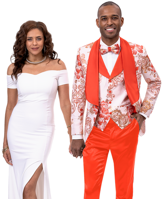 A couple stands together, both smiling. The woman wears a white dress, and the man showcases his fashion-forward sense in an EJ Samuel Rust Suit JP106 with a matching bowtie and a red scarf.