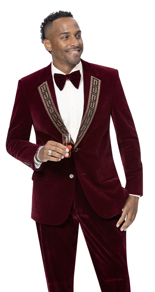 A man in the EJ Samuel Burgundy Suit JP110, featuring a sequined design on the patterned lapel, elegantly holds a drink.