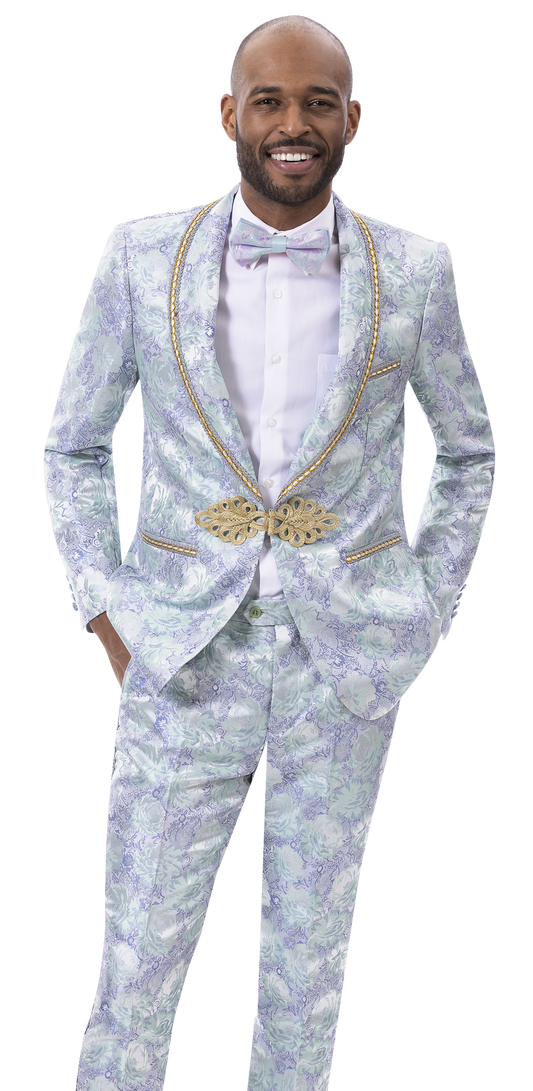 Man in a stylish fashion outfit, sporting an EJ SAMUEL Blue/Green Suit JP118 with gold detail and matching bow tie, smiles confidently with hands in pockets.