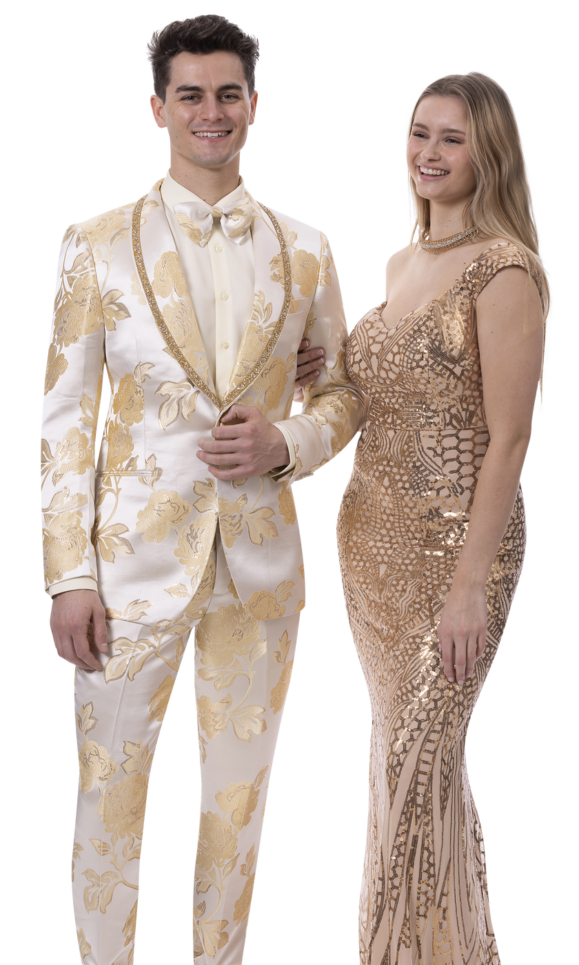 A man wearing the EJ Samuel Gold Suit JP121 by EJ SAMUEL and a woman in a one-shoulder, gold-patterned gown stand side by side, smiling.