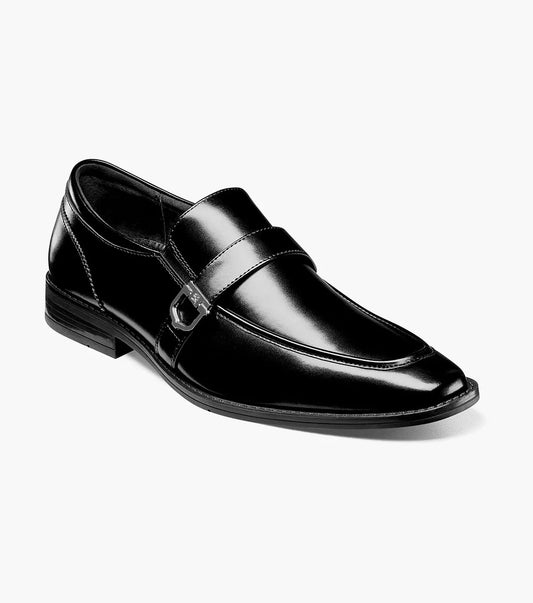 Introducing the STACY ADAMS KESTER Moc Toe Bit Loafer in black, product number 20195-001. This men's loafer boasts a moc toe design, complete with a strap and metal buckle detail. Crafted with a low heel and stitched accents, it embodies classic style.