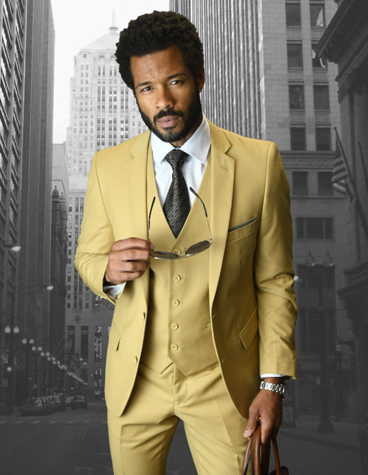 A man in a chestnut slim fit suit by Statement Clothing stands on a city street, holding sunglasses.