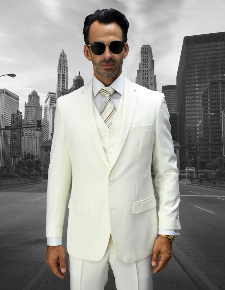 A man in a slim fit suit and sunglasses stands in front of a cityscape with tall buildings, showcasing the classic elegance of the LORENZO-OFFWHT SU by Statement Clothing.