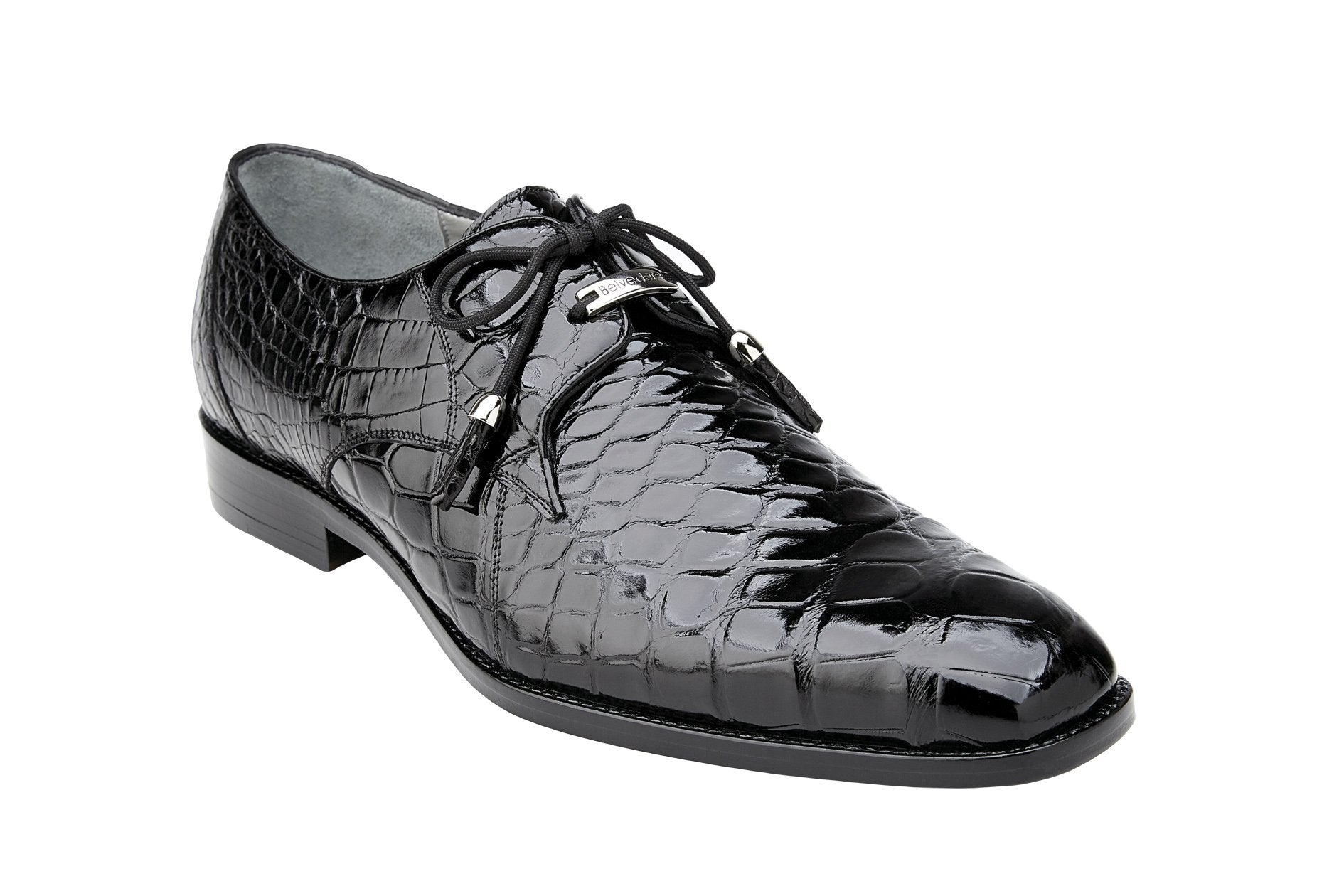 A single Belvedere Lago 14010 Black shoe, made from black patent leather and adorned with tassel laces, rests elegantly on a light-colored floor.