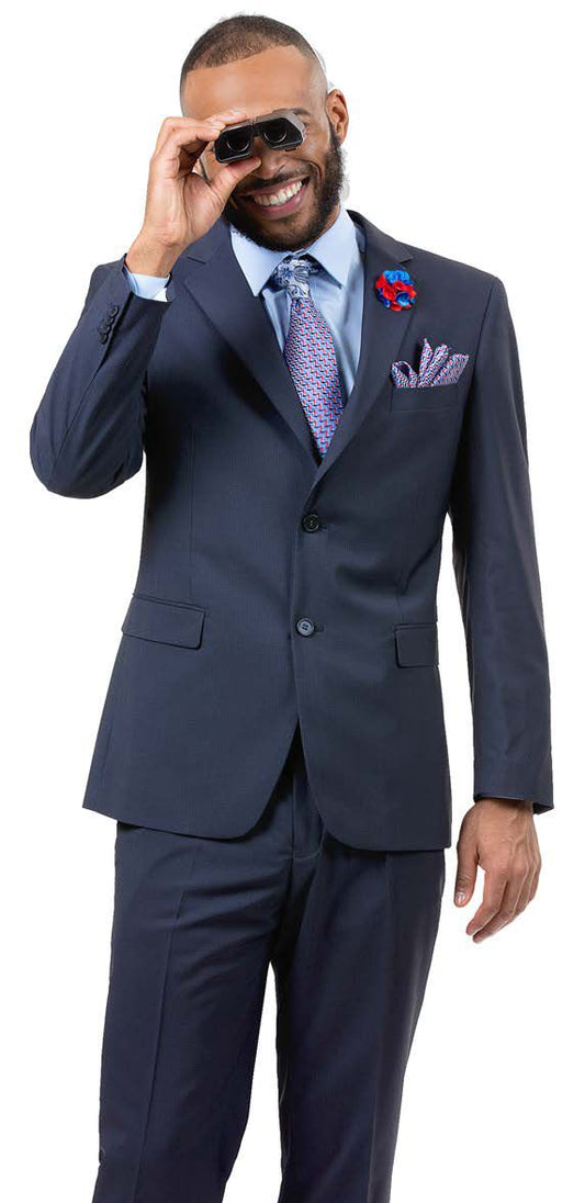 Man in an EJ Samuel Blue Slim Fit Suit M18017 with a notch lapel, smiling and holding sunglasses to his face.