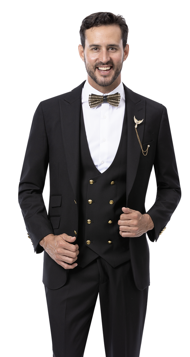 A man in an EJ Samuel Black Suit M2771 from the EJ SAMUEL brand, styled with a bow tie and gold brooch, resting his hand on the jacket adorned with elegant gold buttons.