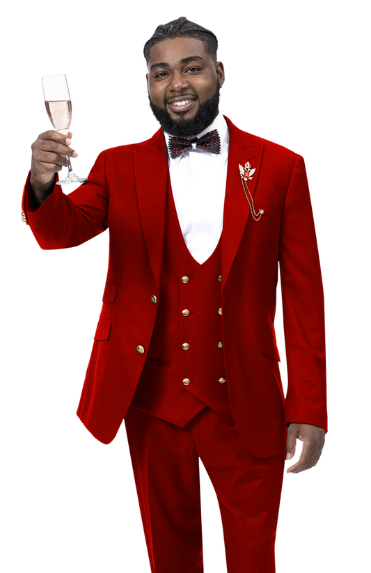 A man wearing the EJ Samuel Red Suit M2771 with gold buttons and a bow tie lifts a champagne glass, smiling.