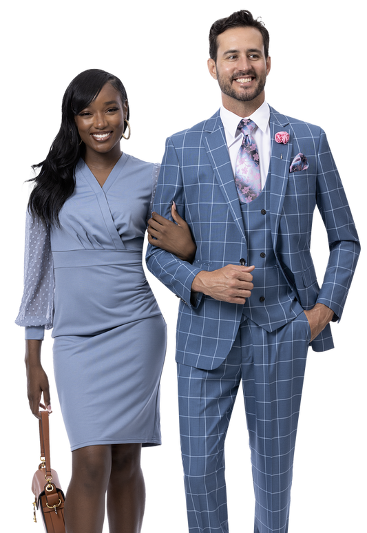 A woman in a blue dress and a man wearing the elegant EJ Samuel Teal Suit M2773, both smiling and posing side by side, epitomize sophisticated fashion from the EJ SAMUEL brand.