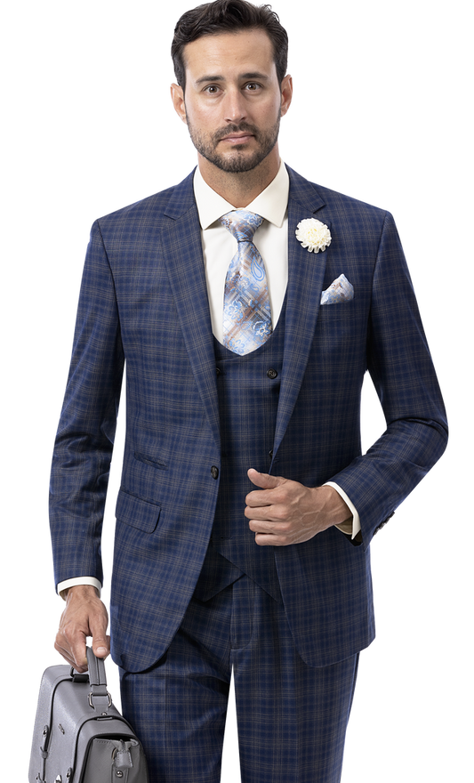 A man clad in the EJ Samuel Blue Suit M2780 holds a gray briefcase. Embracing the essence of fancy fashion, he pairs it with a white shirt, patterned tie, and adorns his lapel with a white flower.