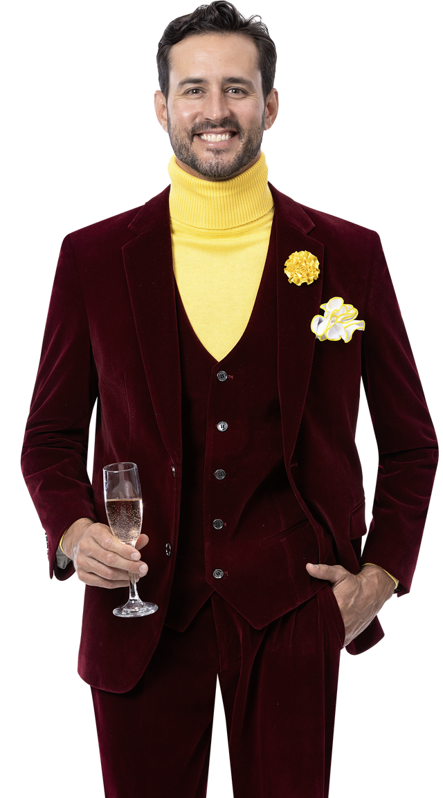 A man dressed in the sophisticated EJ Samuel Wine Suit M2781 by EJ SAMUEL, accessorized with a yellow turtleneck and a yellow flower pinned to the lapel, holding a champagne glass.