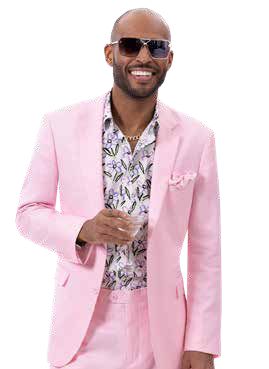 A person wearing an EJ SAMUEL Pink Suit M2792 and sunglasses, smiling and standing with one hand raised slightly.