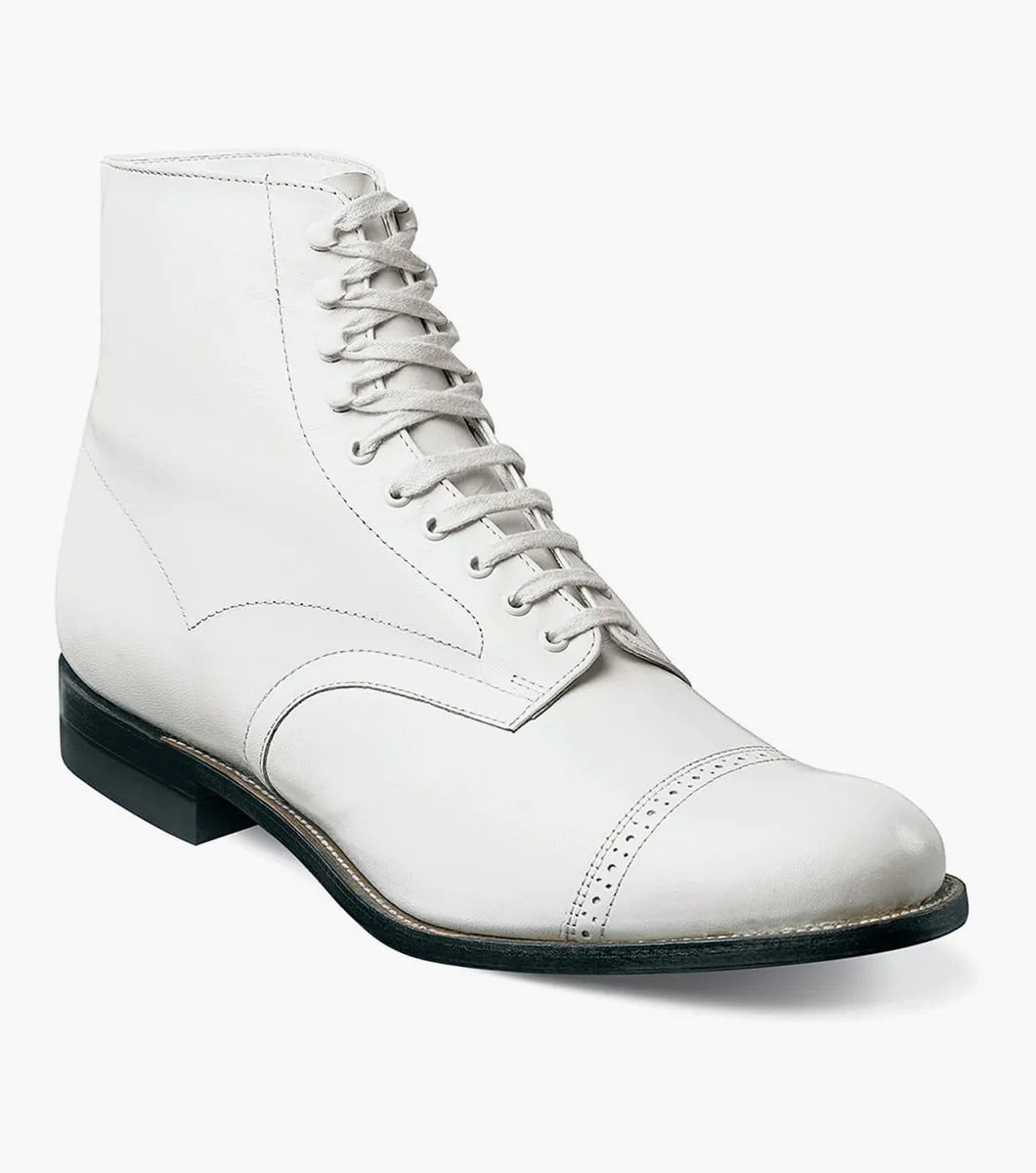 The Stacy Adams MADISON Cap Toe Boot in white is a kidskin leather lace-up boot with a cap toe and black sole, designed using Goodyear welted construction for long-lasting durability.