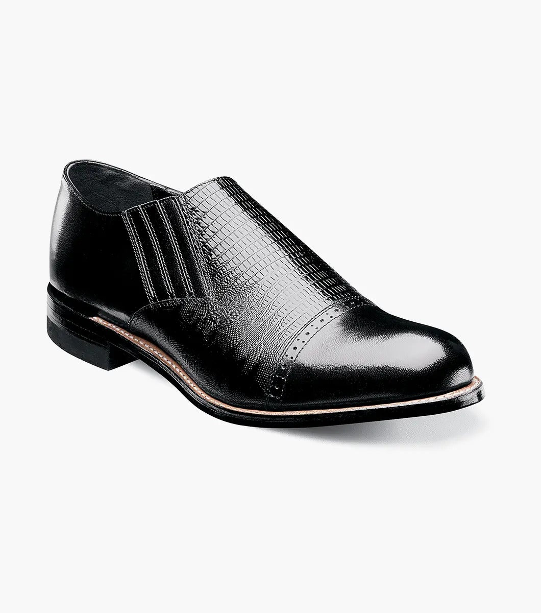 Stacy Adams' MADISON Cap Toe Slip On in black, model 00067-001, is crafted from premium kidskin leather and features textured detailing with a glossy finish.