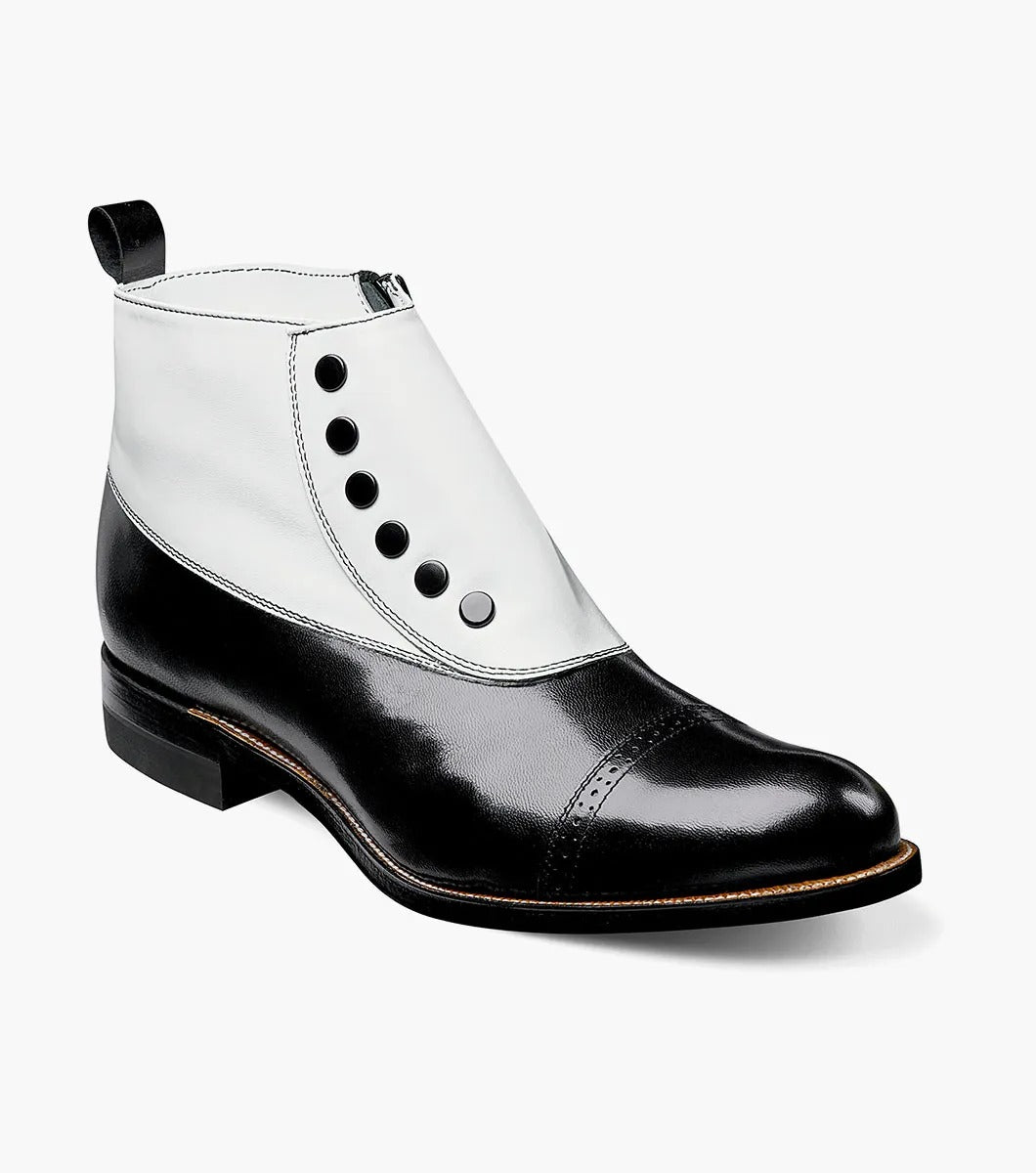 Explore the Stacy Adams MADISON Spectator Spat Cap Toe Boot, featuring a sophisticated black and white button-up ankle design crafted from premium kidskin leather. This boot, offered by STACY ADAMS, is constructed with a Goodyear welt for durability, boasts a polished finish, and includes a low heel that exudes timeless elegance.