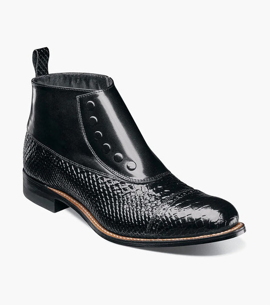 The STACY ADAMS MADISON Spectator Spat Cap Toe Demi Boot in black features a textured pattern, button detailing, Goodyear welt construction, and a convenient pull tab at the back.