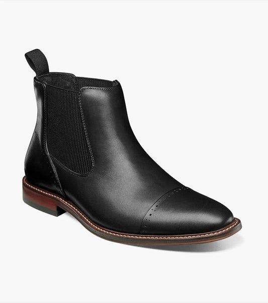 Stacy Adams MAURY Cap Toe Chelsea Boot in black burnished leather, featuring elastic side panels, a cap toe design, and a brown sole on a white background.