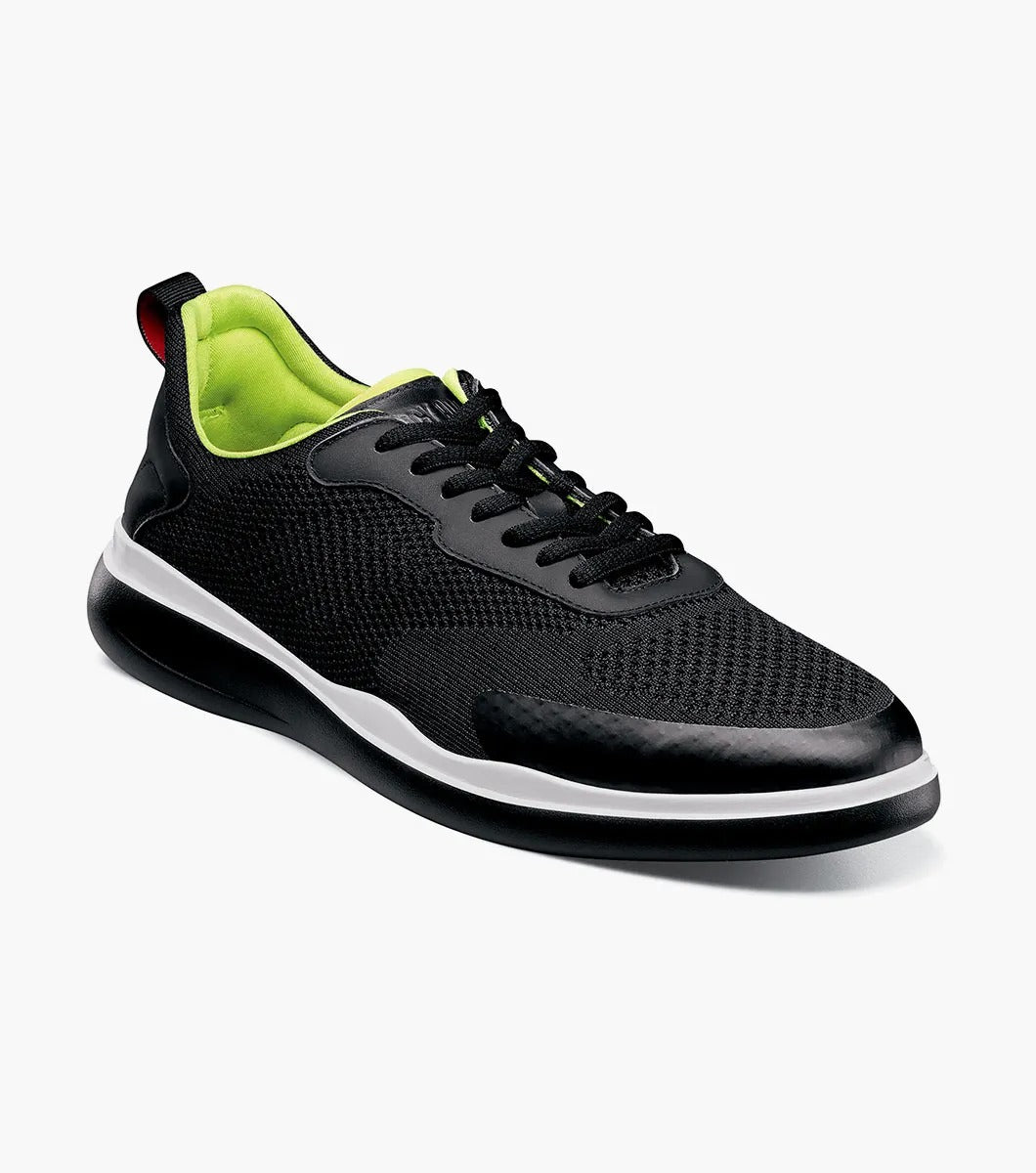 Introducing the Stacy Adams - MAXSON Moc Toe Lace Up Sneaker in black (25517-001) by STACY ADAMS. This stylish sneaker showcases a mesh upper, complemented by a vibrant green interior and a crisp white midsole. Designed for comfort, it features an athletic sole for an easy stride, along with a handy heel pull-tab and coordinating black laces.