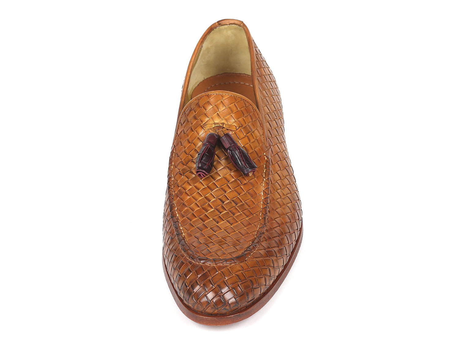 The Paul Parkman Woven Leather Tassel Loafers Camel - WVN44-CML, crafted by Paul Parkman, are men's shoes made from woven leather featuring elegant tassels and low wooden heels. Viewed from the top and side, these loafers embody a blend of style and comfort.