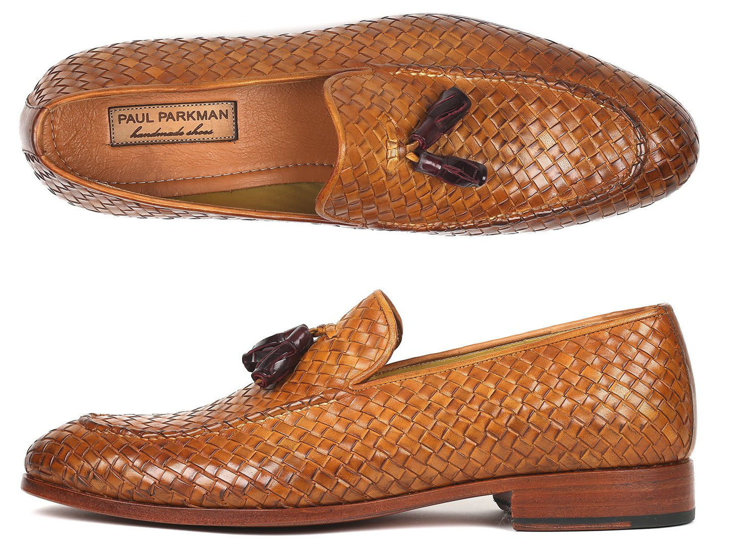 The Paul Parkman Woven Leather Tassel Loafers Camel - WVN44-CML, crafted by Paul Parkman, are men's shoes made from woven leather featuring elegant tassels and low wooden heels. Viewed from the top and side, these loafers embody a blend of style and comfort.