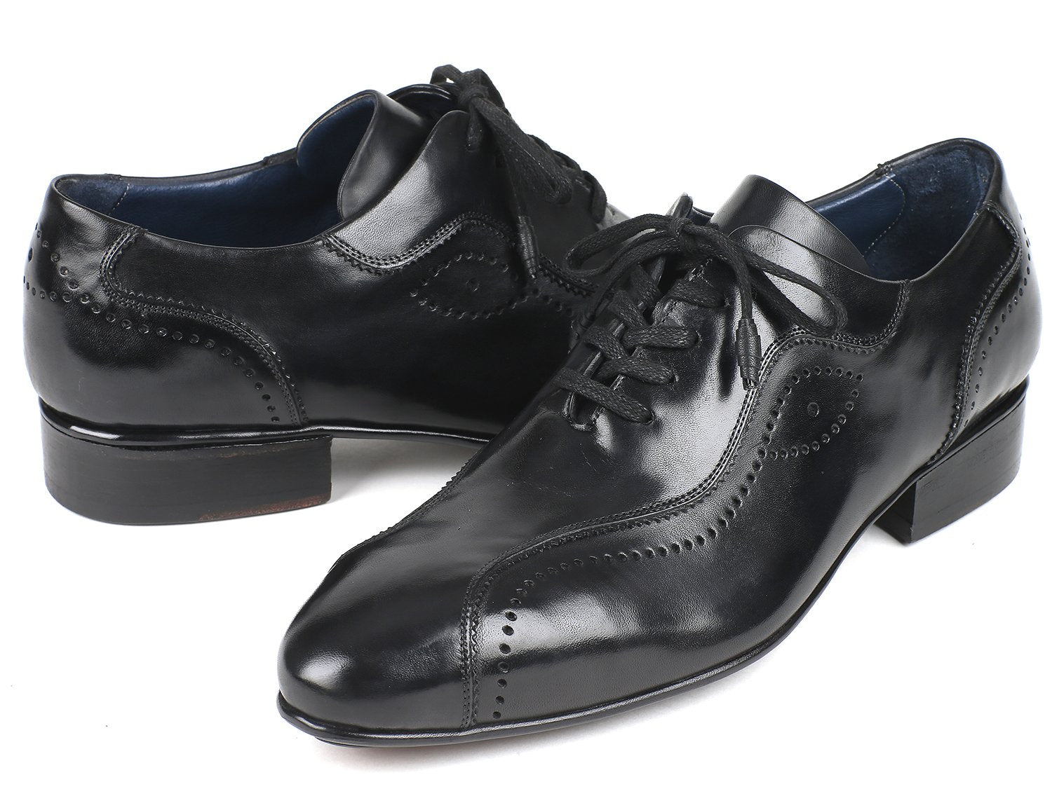 Paul Parkman presents the Handmade Lace-Up Casual Shoes in black, model 84654-BLK. These elegant shoes feature decorative perforations and are crafted from exquisite Italian calfskin, beautifully displayed on a white background.