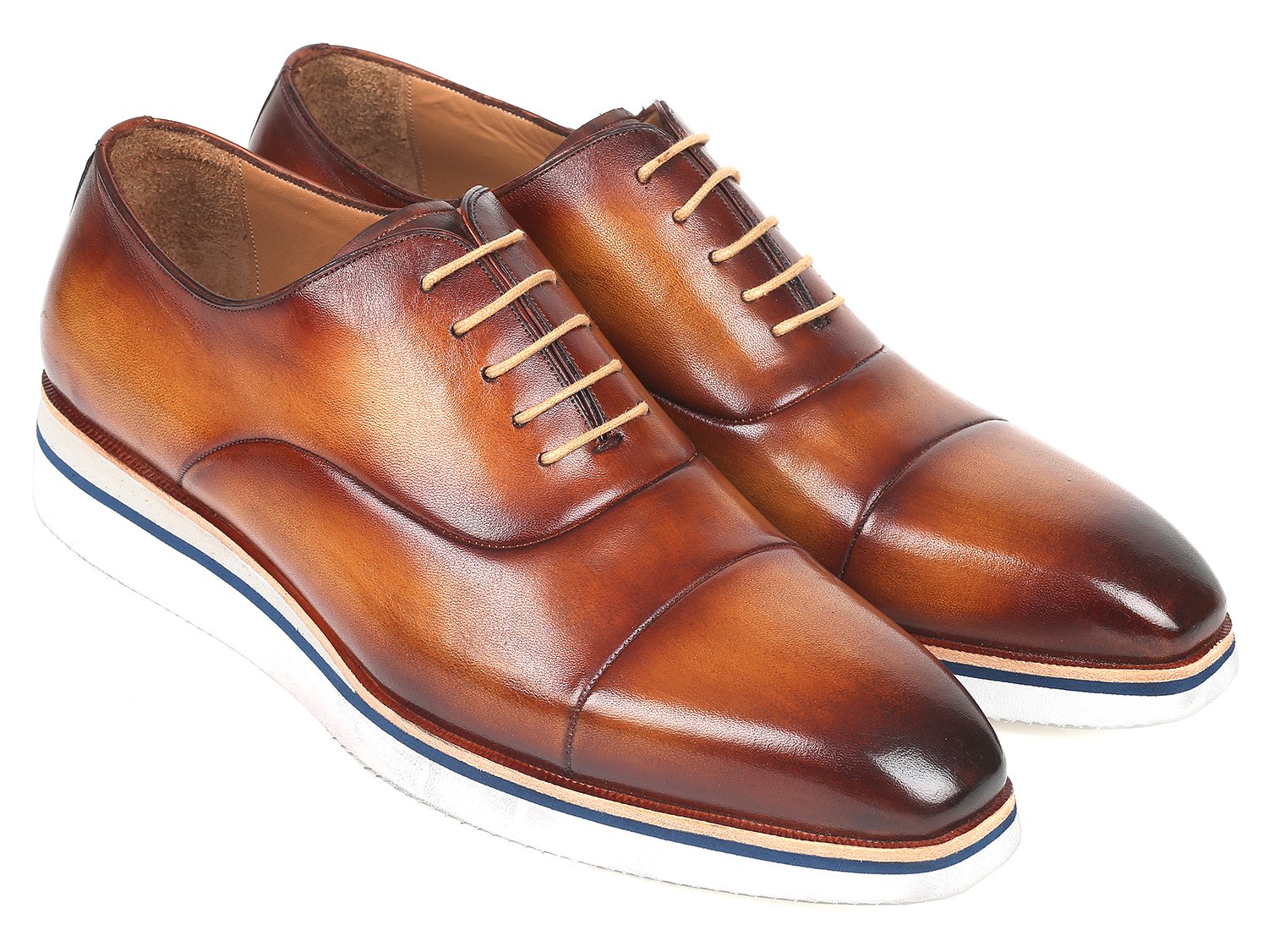 The Paul Parkman Smart Casual Oxfords in Brown & Camel Leather, model 185-BRW-LTH, are exquisitely crafted from hand-painted calfskin and feature a striking combination of white soles and tan laces. The polished finish imparts an elegant touch, making them ideal for smart casual occasions.