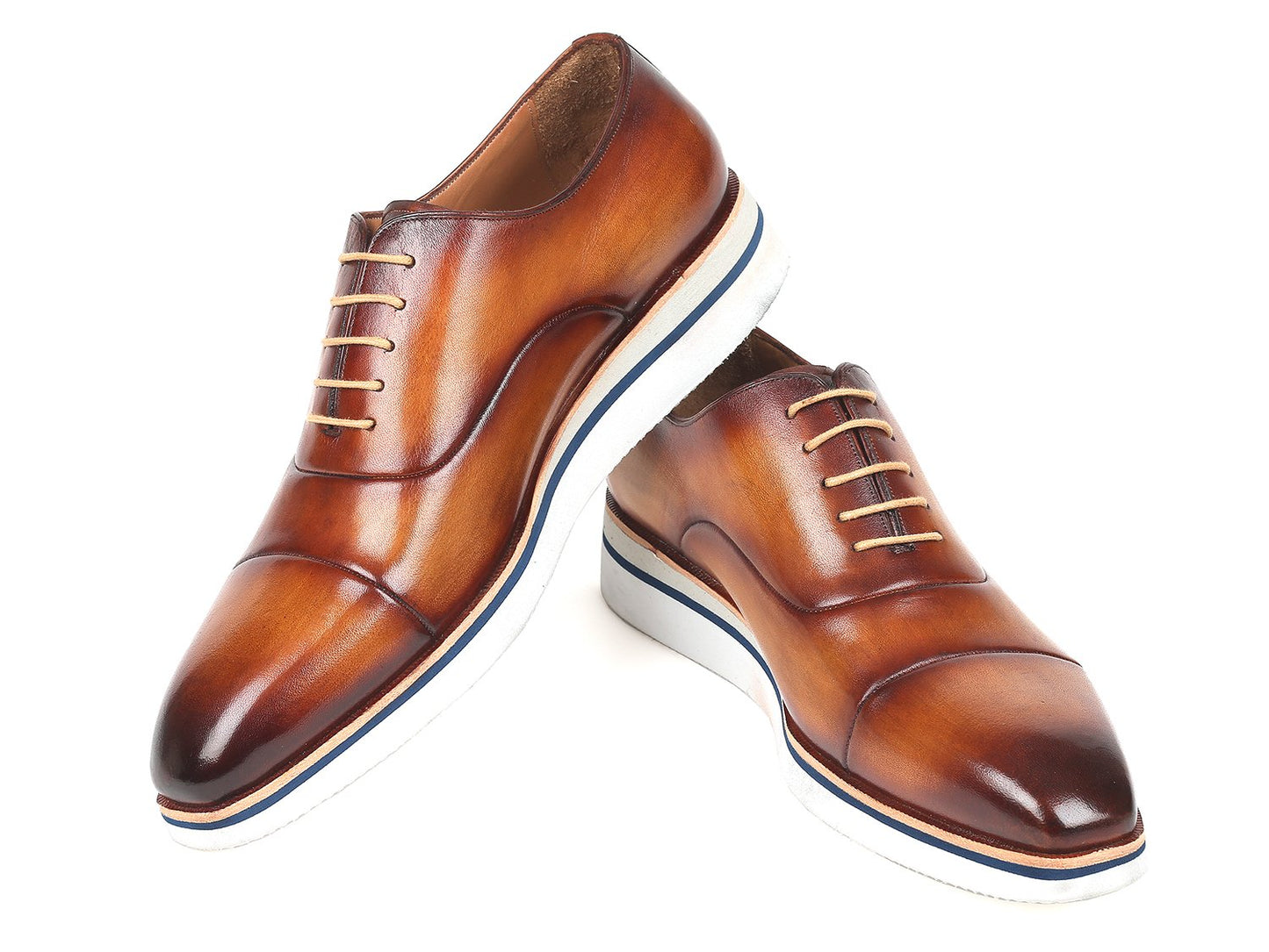 The Paul Parkman Smart Casual Oxfords in Brown & Camel Leather, model 185-BRW-LTH, are exquisitely crafted from hand-painted calfskin and feature a striking combination of white soles and tan laces. The polished finish imparts an elegant touch, making them ideal for smart casual occasions.