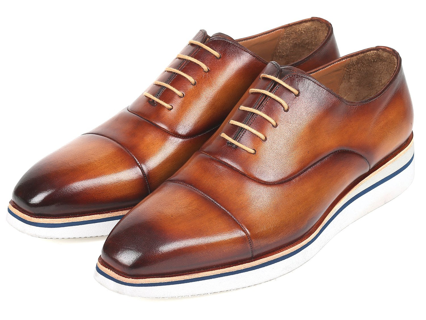 The Paul Parkman Smart Casual Oxfords in Brown & Camel Leather, model 185-BRW-LTH, are exquisitely crafted from hand-painted calfskin and feature a striking combination of white soles and tan laces. The polished finish imparts an elegant touch, making them ideal for smart casual occasions.