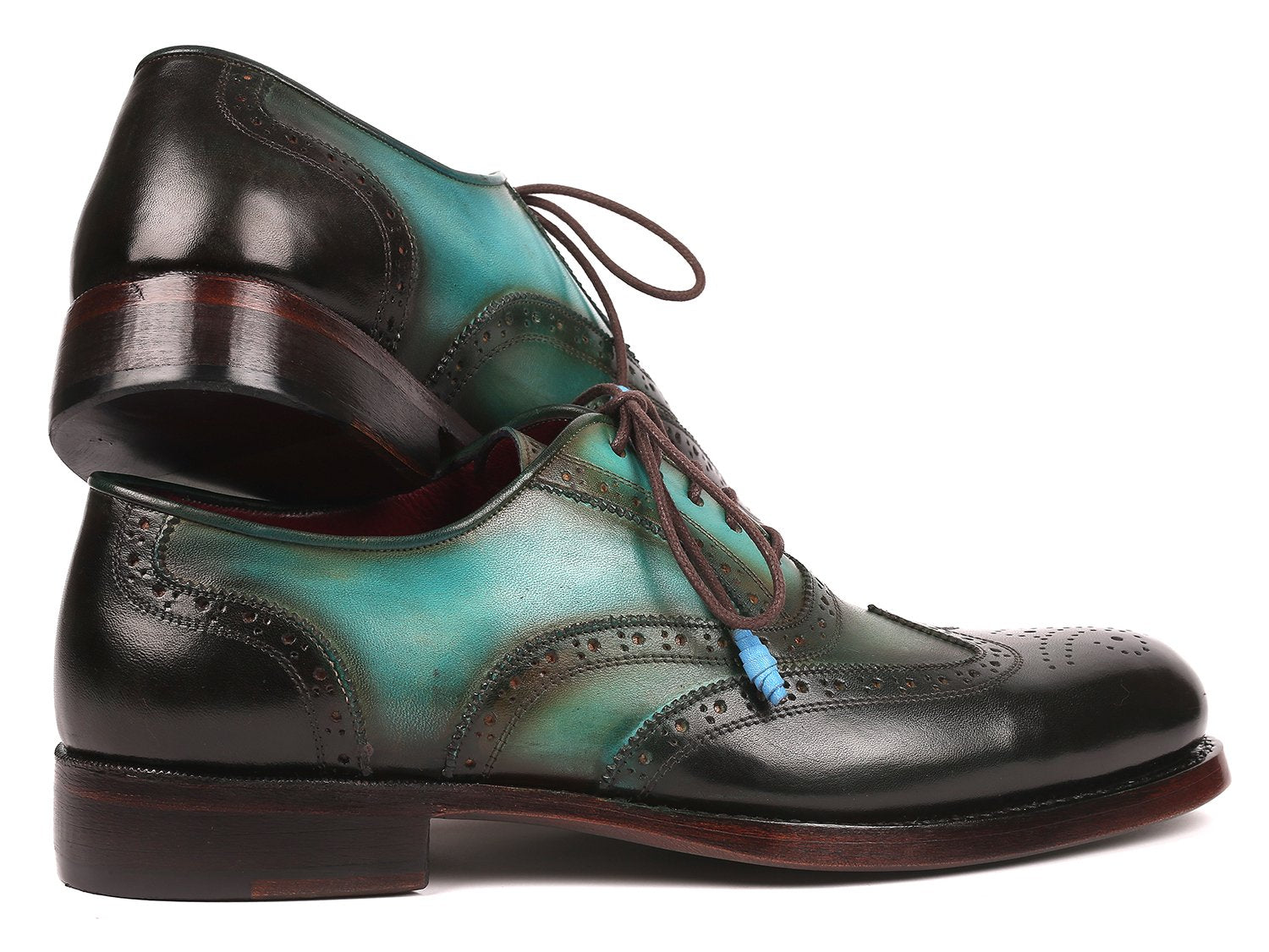 A pair of Paul Parkman Brown & Green Wingtip Oxfords, Goodyear welted, featuring exquisite craftsmanship with a polished finish in shades of green and black, complemented by brown laces and blue lace tips.