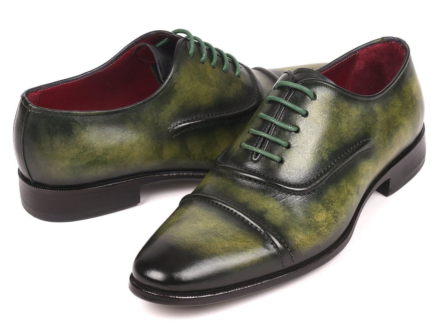 The Paul Parkman Captoe Oxfords Green - 077-GRN are expertly crafted men's shoes made-to-order, highlighting a striking green leather design with cap toes and matching green laces. These shoes feature the finest hand-painted leather for a distinctive touch, brought to you by the renowned brand, Paul Parkman.