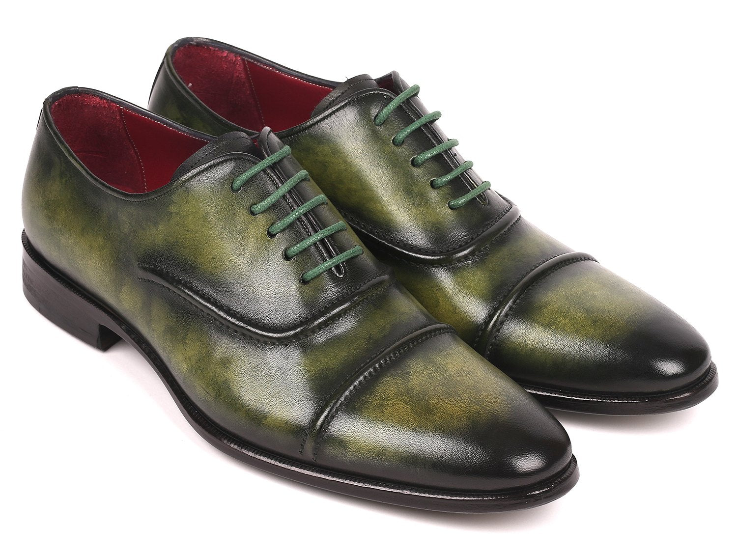 The Paul Parkman Captoe Oxfords Green - 077-GRN are expertly crafted men's shoes made-to-order, highlighting a striking green leather design with cap toes and matching green laces. These shoes feature the finest hand-painted leather for a distinctive touch, brought to you by the renowned brand, Paul Parkman.