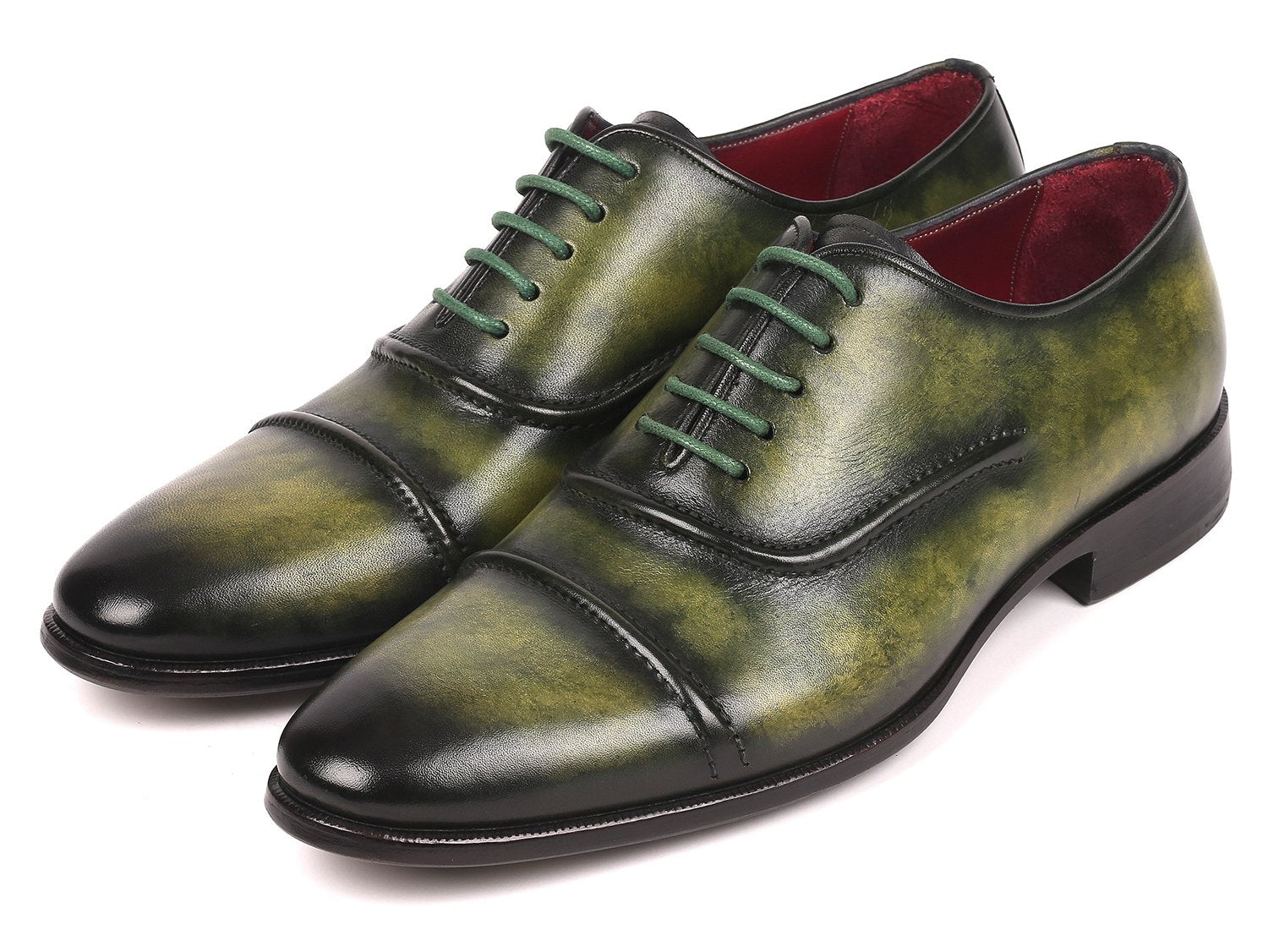 The Paul Parkman Captoe Oxfords Green - 077-GRN are expertly crafted men's shoes made-to-order, highlighting a striking green leather design with cap toes and matching green laces. These shoes feature the finest hand-painted leather for a distinctive touch, brought to you by the renowned brand, Paul Parkman.