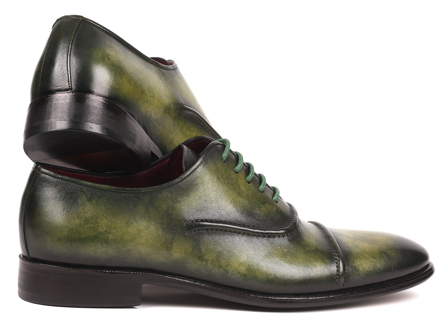 The Paul Parkman Captoe Oxfords Green - 077-GRN are expertly crafted men's shoes made-to-order, highlighting a striking green leather design with cap toes and matching green laces. These shoes feature the finest hand-painted leather for a distinctive touch, brought to you by the renowned brand, Paul Parkman.