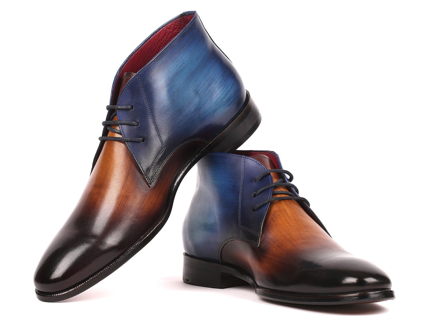 The Paul Parkman Chukka Boots Brown & Blue - CK67L6 offer a handmade craftsmanship, featuring hand-painted calfskin with a stunning gradient design in shades of blue, brown, and black. These polished leather boots include laces and slightly raised heels, all atop a durable leather sole for a touch of timeless elegance.