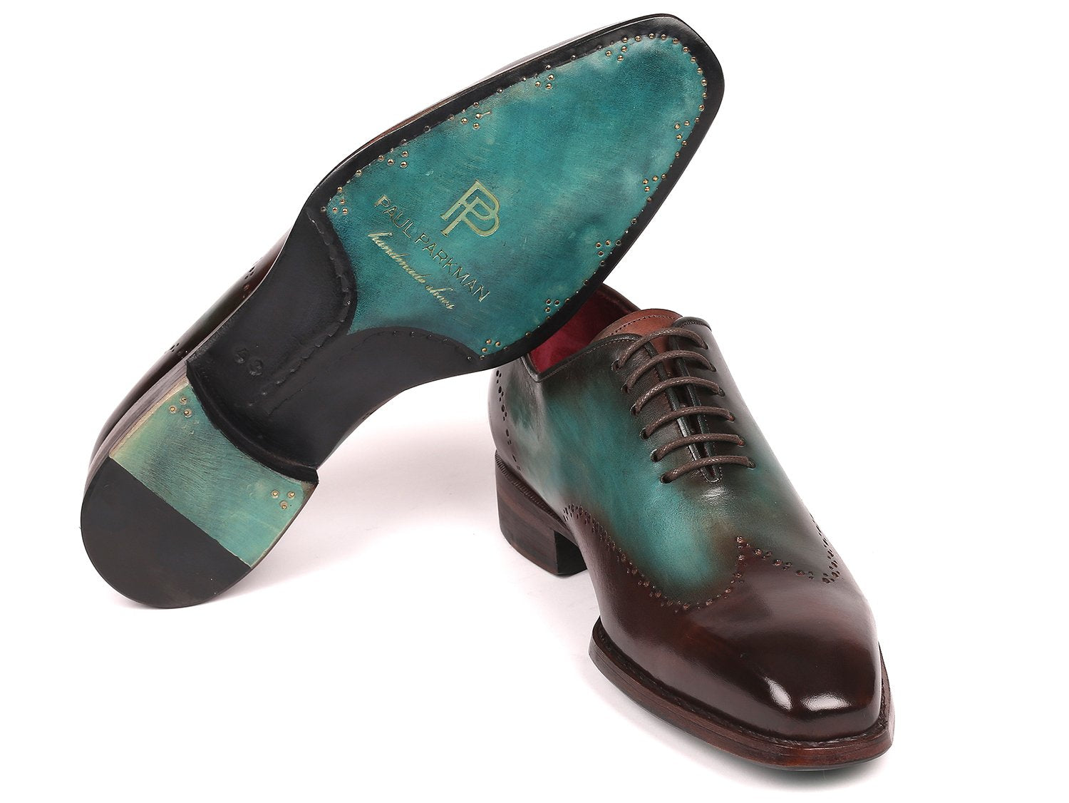 Experience the Paul Parkman Goodyear Welted Wingtip Oxfords in Brown & Turquoise (081-BTQ), featuring polished leather with decorative perforations and a vibrant red interior lining. These brogues combine durability and style with their classic Goodyear welted construction.