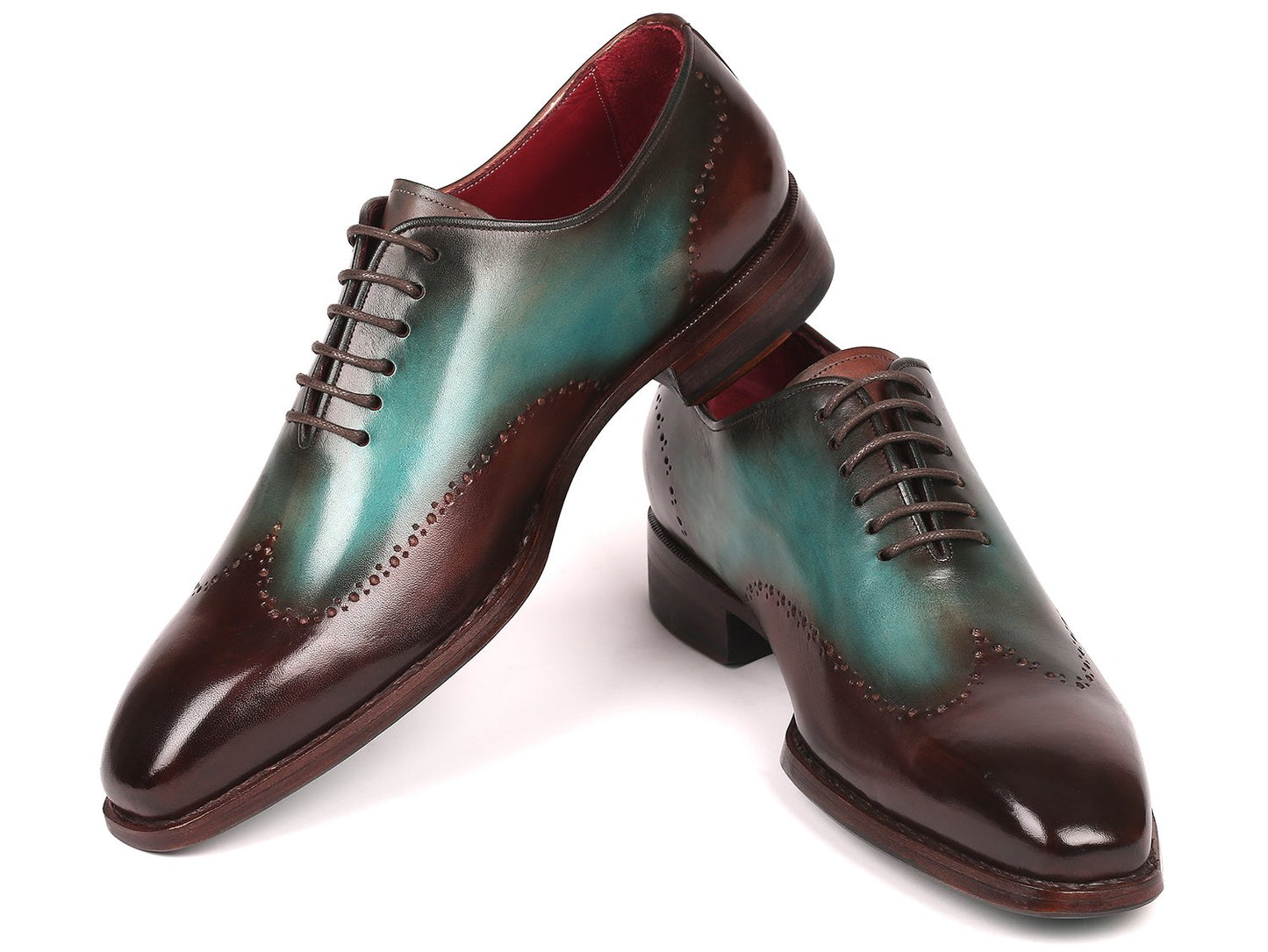 Experience the Paul Parkman Goodyear Welted Wingtip Oxfords in Brown & Turquoise (081-BTQ), featuring polished leather with decorative perforations and a vibrant red interior lining. These brogues combine durability and style with their classic Goodyear welted construction.