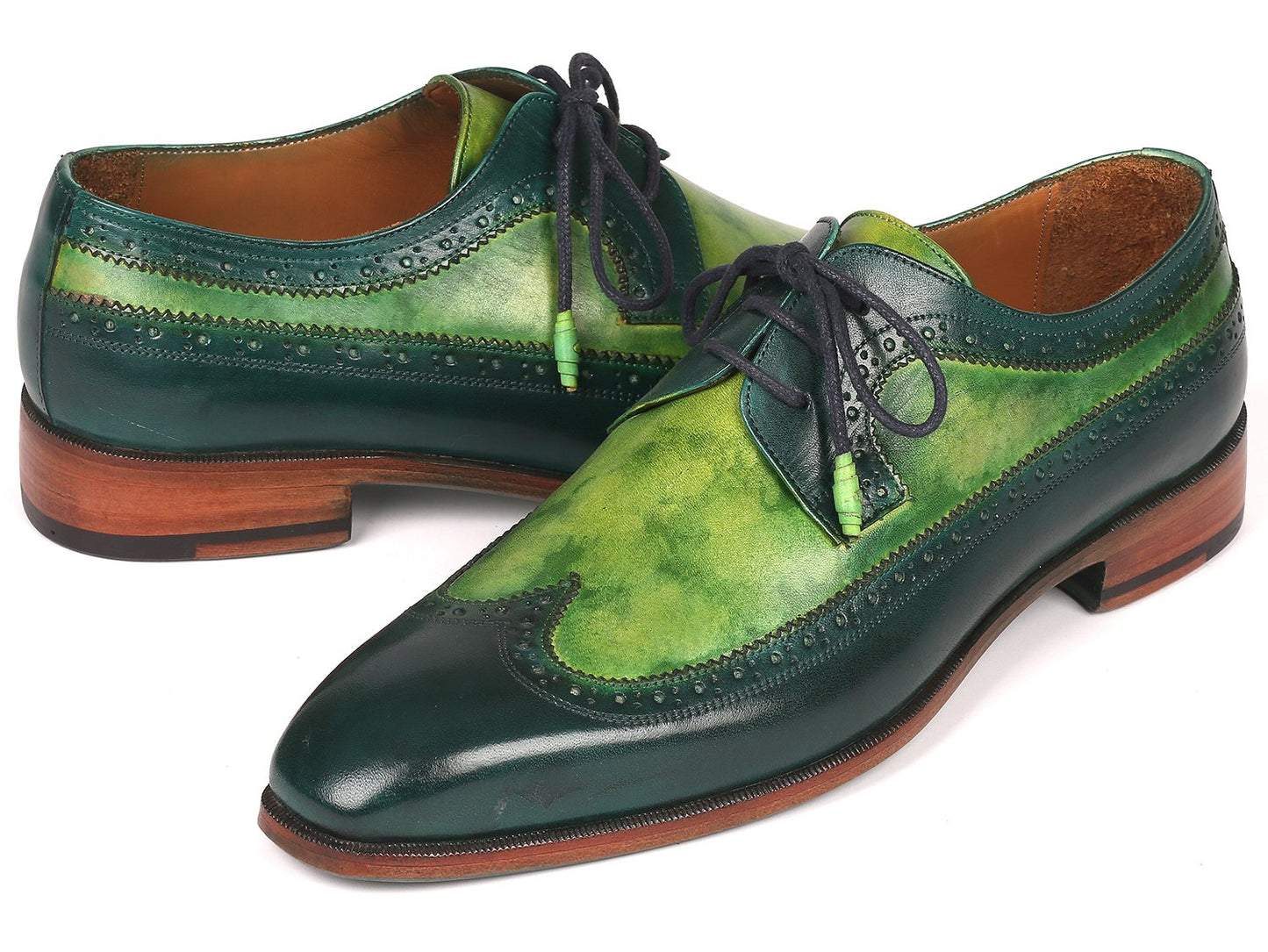 The Paul Parkman Green Dual Tone Wingtip Derby Shoes - 6931GRN is an elegant pair of shoes crafted from exquisite hand-painted calfskin, featuring a sophisticated green and black leather design with contrasting black laces and brown soles for a unique touch.