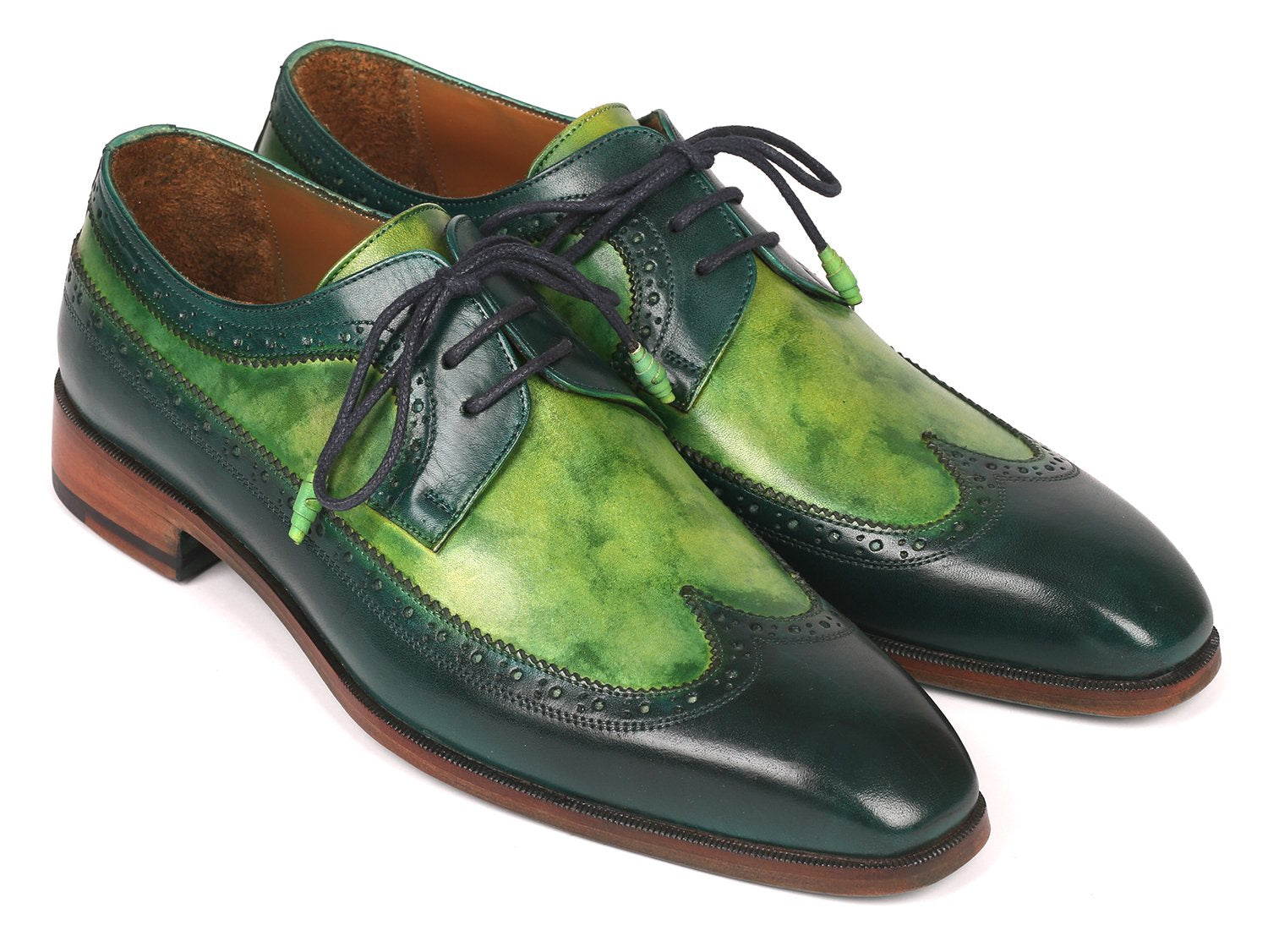 The Paul Parkman Green Dual Tone Wingtip Derby Shoes - 6931GRN is an elegant pair of shoes crafted from exquisite hand-painted calfskin, featuring a sophisticated green and black leather design with contrasting black laces and brown soles for a unique touch.