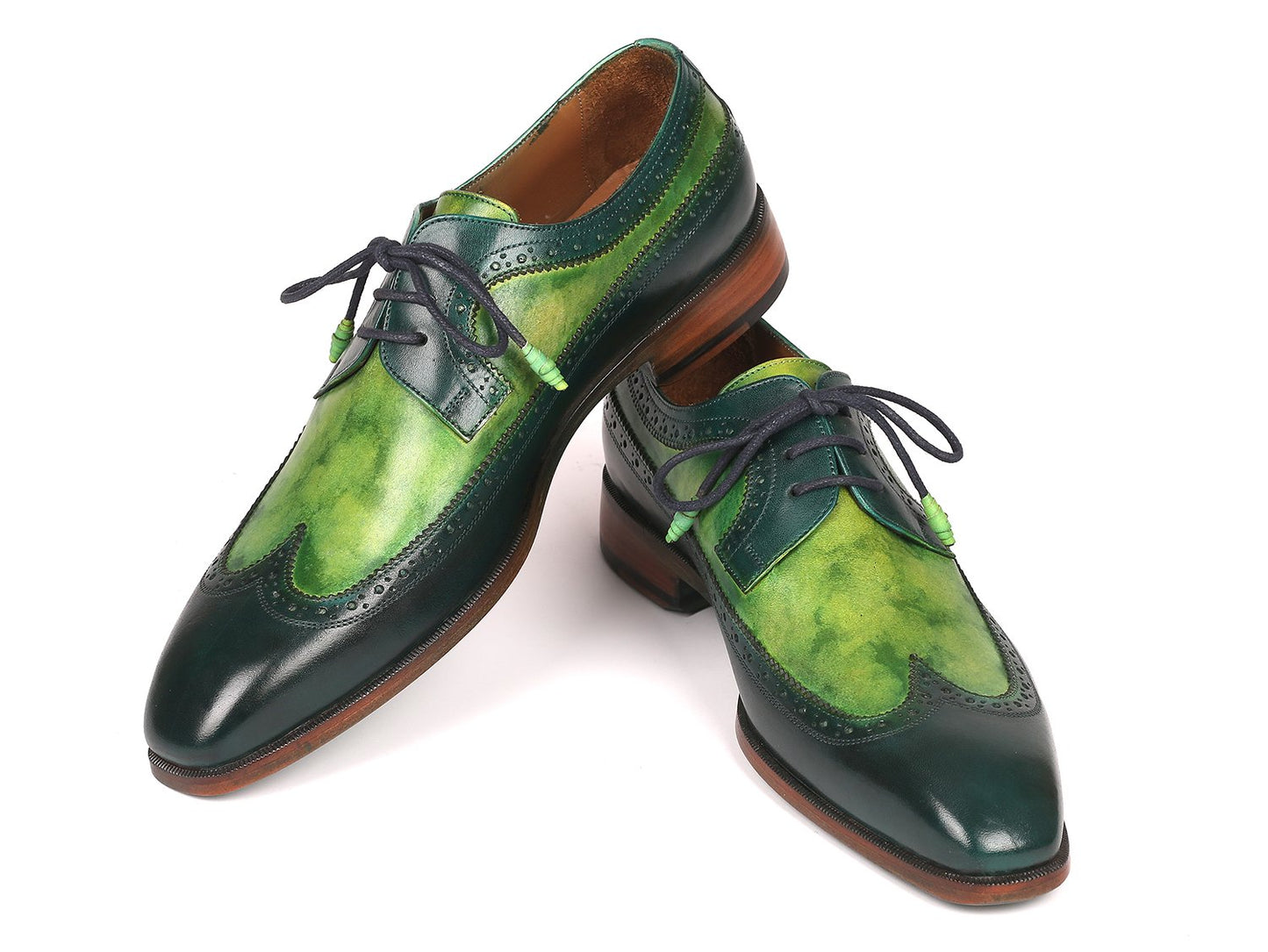 The Paul Parkman Green Dual Tone Wingtip Derby Shoes - 6931GRN is an elegant pair of shoes crafted from exquisite hand-painted calfskin, featuring a sophisticated green and black leather design with contrasting black laces and brown soles for a unique touch.